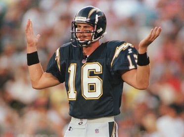 San Diego Chargers' rookie quarterback Ryan Leaf, the number two player taken in this year's NFL draft, tries to figure out what play is being called from the bench during the first quarter against the San Francisco 49ers Saturday Aug. 8, 1998 in San Diego. Leaf completed 14 of 20 passes for 116 yards and one touchdown.(AP Photo/Kent Horner)