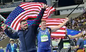 From left, silver medalist for the men's shot put United States' Joe Kovacs, gold medallist and compatriot Ryan Crouser and New Zealand's Tomas Walsh, bronze, celebrate with their national flags during the athletics competitions of the 2016 Summer Olympics at the Olympic stadium in Rio de Janeiro, Brazil, Thursday, Aug. 18, 2016. (AP Photo/Lee Jin-man)